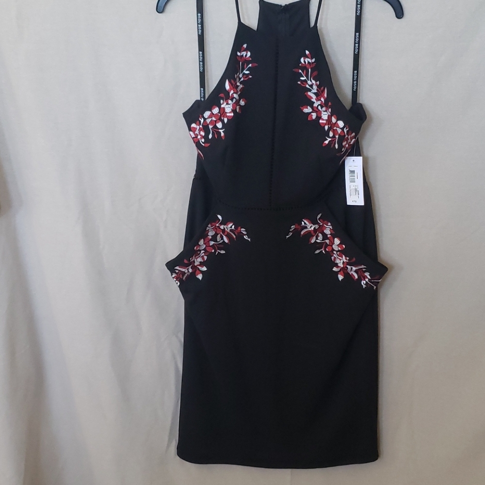 New with Tags! Black fitted dress with pockets!